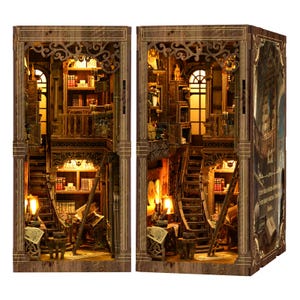 May include: A wooden bookshelf diorama with intricate details, featuring a multi-level interior with stairs, books, and warm lighting. The design includes decorative archways and a ladder, creating a miniature library scene. The diorama is a warm brown color.