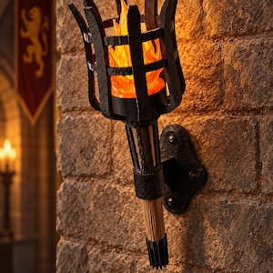 May include: A wall-mounted torch light fixture featuring a black metal cage frame with a textured finish. The torch contains a realistic orange and yellow flame effect light. It is attached to a stone wall via a black metal mounting plate with bolts.