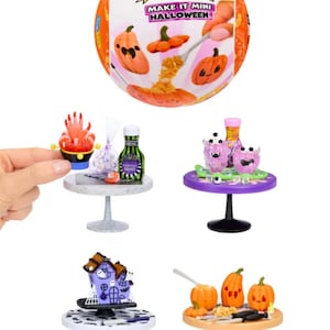 May include: Miniature Halloween-themed food and decor sets. The sets include tiny tables with various items like pumpkins, a haunted house, and monster-themed treats. The packaging features the text "MAKE IT MINI HALLOWEEN".