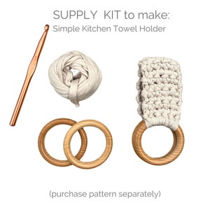 May include: A craft kit to make a simple kitchen towel holder. The kit includes a ball of beige yarn, a wooden ring, a crochet hook, and a crocheted sample of the finished product.  SUPPLY KIT to make: Simple Kitchen Towel Holder (purchase pattern separately)