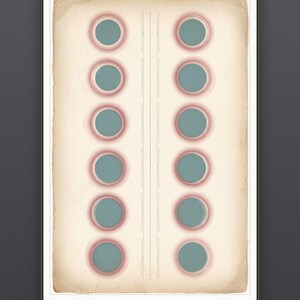 May include: A framed rectangular print on aged, cream-colored paper featuring two vertical columns of six teal circles, each surrounded by a soft pink ring. A thin, decorative vertical line pattern runs down the center. Text at the bottom reads MULTIPLE SIZES · INCHES & CM.
