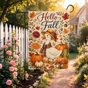 May include: A rectangular garden flag featuring a white background with the text Hello Fall in dark script. The design includes a white duck wearing a straw hat and plaid scarf, surrounded by orange pumpkins, gourds, mushrooms, and autumn leaves.