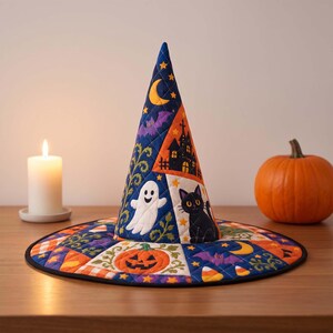 May include: A quilted witch hat featuring a colorful patchwork design with Halloween motifs including a white ghost, a black cat, a jack-o'-lantern, purple bats, yellow crescent moons, and orange candy corn on a dark blue and orange background.