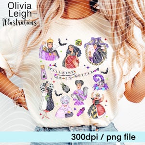 May include: Cream-colored t-shirt featuring colorful illustrations of various cartoon villains, with the text "Villains Do It Better." The design includes images of evil queens and other characters, along with bats and stars. The text "Olivia Leigh Illustrations" is at the top.
