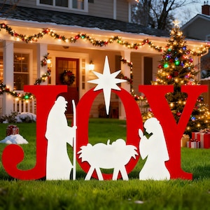 May include: A red and white outdoor Christmas decoration spelling out the word "JOY". The "J" features a silhouette of a man with a staff, the "O" has a star, and the "Y" has a silhouette of a woman.