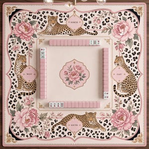May include: A square mahjong mat featuring a pale pink background with a leopard print border, large pink peony illustrations, and four leopards positioned at the North, South, East, and West compass points. Pink mahjong tiles are arranged in rows.