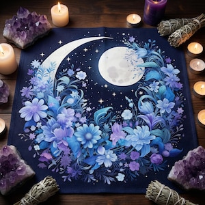 May include: A dark blue altar cloth with a full moon and crescent moon design, encircled by blue and purple flowers. Amethyst crystals, sage bundles, and lit candles are arranged around the cloth.