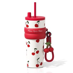 May include: A white tumbler with a red cherry pattern, a red lid, and a matching red straw. A red silicone band features the text Happy Supply Chain. A red cherry charm hangs from a black ring attached to the side of the silicone band.
