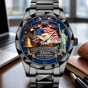 May include: A black metal wristwatch with a blue dial featuring a bald eagle, the Statue of Liberty, the Liberty Bell, and an American flag. The dial includes the text JAMES, UNITED STATES OF AMERICA, 250th ANNIVERSARY, 1776-2026, and SUN 8.