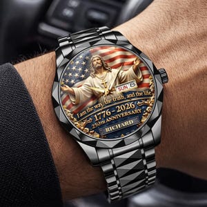 May include: A black stainless steel wristwatch with a detailed face featuring an image of Jesus with the American flag in the background. The watch face includes the text "I am the way, the truth, and the life" and "1776-2026 250th Anniversary RICHARD".