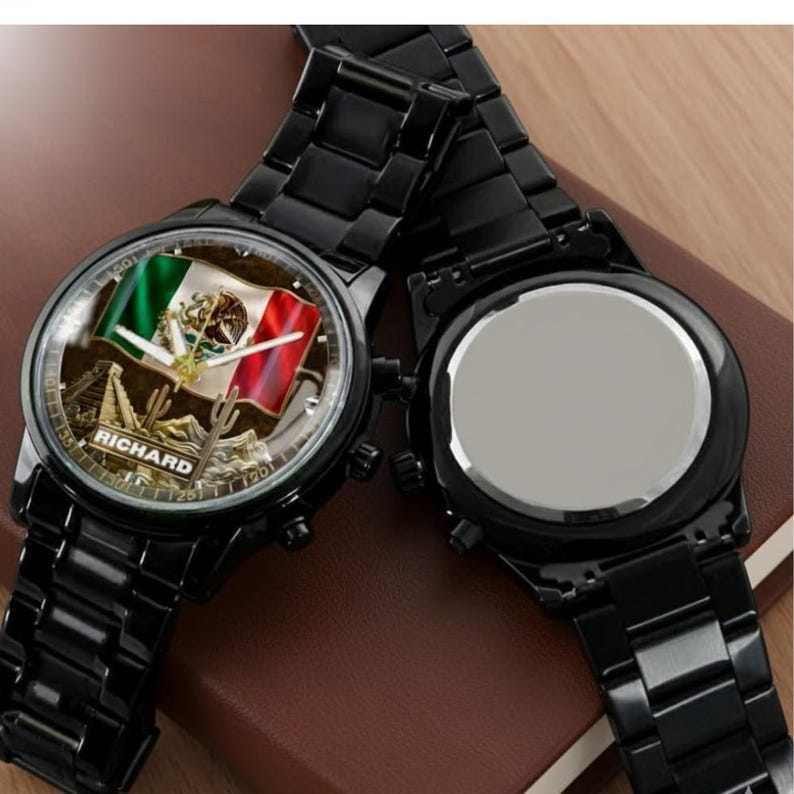 May include: Black wristwatch featuring a watch face with the Mexican flag and the name "RICHARD". The watch has a black metal band and casing. The watch face displays the flag's green, white, and red colors.
