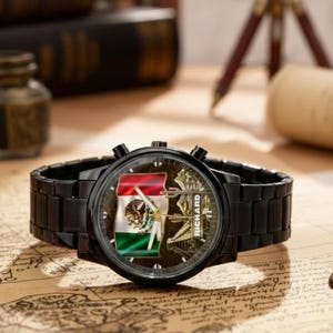 May include: A black wristwatch with a metal band. The watch face features the Mexican flag and the word "RICHARD". The watch is displayed on a map.