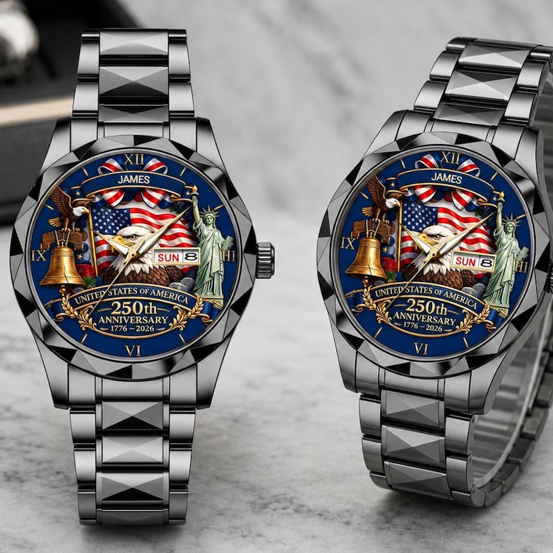 May include: Two silver-toned metal watches with dark blue faces featuring a bald eagle, the Statue of Liberty, a Liberty Bell, and an American flag. The text reads JAMES, UNITED STATES OF AMERICA, 250th ANNIVERSARY, 1776-2026, and SUN 8.