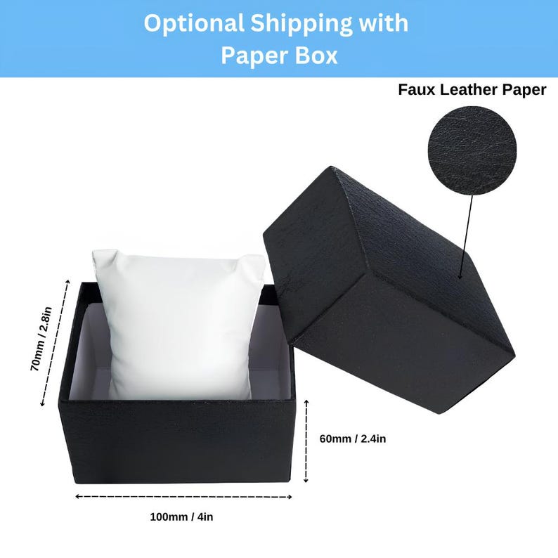 May include: Black watch box with a white pillow inside. The box is open, revealing the interior. The dimensions are 10 cm long, 7 cm high, and 6 cm wide. The text "Optional Shipping with Paper Box" is visible.