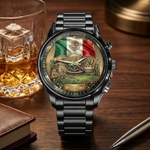 May include: Black wristwatch with a detailed face featuring the Mexican flag and a landscape scene. The watch has a black metal strap and a gold-toned face. The name "Ricardo" is printed on the watch face.