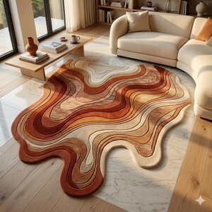 Pode incluir: Um tapete abstrato com uma forma fluida e orgânica. O tapete apresenta um design em camadas com tons quentes de castanho, laranja e creme, criando um visual texturizado. Este revestimento de chão decorativo adiciona um toque moderno a qualquer espaço habitável. (Aprox. 200 x 150 cm)
