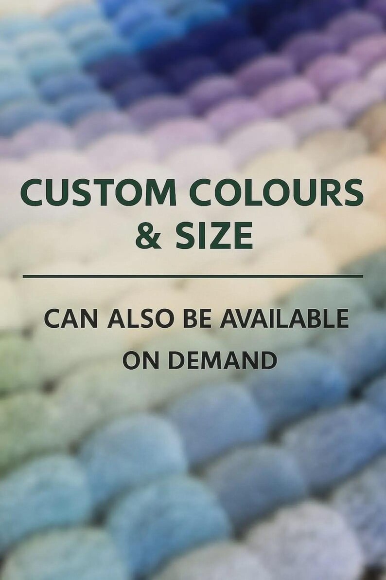 May include: A textured surface composed of numerous small, rounded felt-like spheres in a gradient of blue, purple, and white tones. The text reads: CUSTOM COLOURS & SIZE CAN ALSO BE AVAILABLE ON DEMAND, with a horizontal line separating the two lines.