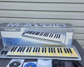 Controlador de teclado MIDI USB M Audio Keystation 49e con manual y cables.