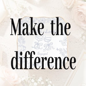 May include: A square ceramic trinket dish with a scalloped gold rim, featuring a light blue floral pattern, a graphic of two clinking champagne glasses with bows, and the text "Engaged" printed in the centre, surrounded by white floral accents.