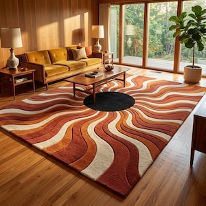 May include: A rectangular area rug featuring a repeating pattern of wavy, concentric lines in shades of burnt orange, cream, and brown. The design radiates outward from a solid black circular centre, creating a sunburst effect across the floor.