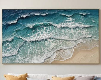 Puede incluir: Un cuadro rectangular que muestra una vista aérea de olas oceánicas rompiendo en una playa de arena. La pintura presenta capas texturizadas de azul profundo, turquesa y espuma de mar blanca, contrastando con la arena beige clara inferior.