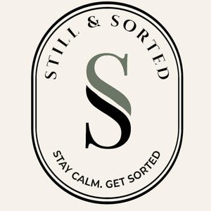 May include: An oval logo with the words "STILL & SORTED" in a circular pattern around the top. The letter "S" is the central design element, with a black and green color scheme. The text "STAY CALM. GET SORTED" is at the bottom.