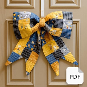 May include: A large, quilted bow in yellow, blue, and gray patchwork, adorned with cartoon character illustrations, hangs on a door. The bow is a decorative item, possibly for seasonal or holiday use. The PDF icon is visible in the lower right corner.