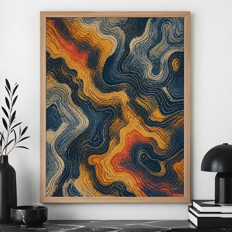 May include: A rectangular wall art print in a light wood frame featuring an abstract design of flowing, wavy lines in shades of deep navy blue, golden yellow, and burnt orange, creating a topographic map effect across the entire surface.
