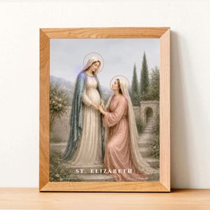 Puede incluir: Una impresi&oacute;n enmarcada que representa una escena religiosa con dos mujeres con t&uacute;nicas y halos, ambientada en un jard&iacute;n con monta&ntilde;as al fondo. El texto "ST. ELIZABETH" est&aacute; en la parte inferior.