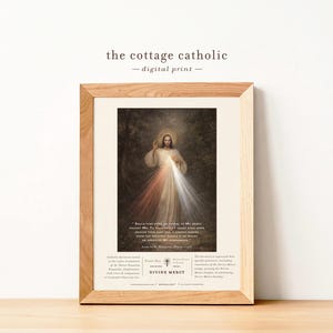 May include: A set of three ceramic mugs with a speckled, cream-coloured glaze. Each mug features a different hand-painted design: a blue and green leaf, a yellow flower, and a red berry. The mugs have a simple, rounded shape.