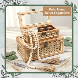 May include: Two-tiered woven storage boxes with a mirror, candles, and a beaded garland. The boxes are made of natural-colored woven material with a decorative woven pattern on the front. The text "Boho Home Decor Organizers" is displayed.