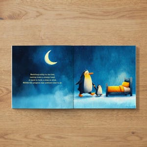 May include: A children's book illustration depicts a nighttime scene with a crescent moon and stars. Two penguins walk towards a bed with yellow bedding. The text reads, "Waddling softly to the bed, resting down a sleepy head. A hand to hold, a step so slow, Olivia the penguin has nowhere else to go."