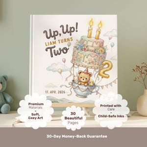 Puede incluir: Una portada de libro de tapa dura con una ilustraci&oacute;n caprichosa de un oso de peluche en un globo aerost&aacute;tico de taza de t&eacute; con un pastel, globos y el texto Up, Up! LIAM TURNS Two y 17. APR. 2026. El dise&ntilde;o incluye colores pastel suaves.