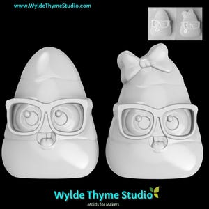 May include: Two white, cartoon-like figures wearing glasses, one with a bow. The figures have a rounded shape with a face and teeth. The image includes the text "Wylde Thyme Studio" and "Molds for Makers".