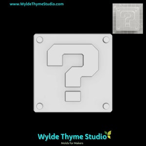 May include: White plastic mold of a question mark block, a popular item in the Super Mario Bros. video game series. The mold is designed to be used for making chocolate or other edible treats.