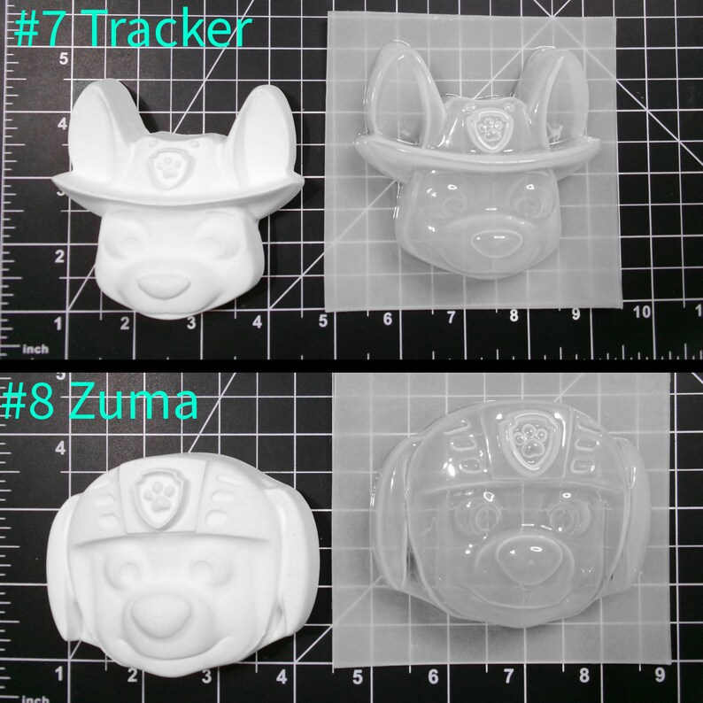 May include: Two clear plastic molds for making resin crafts. The molds are shaped like the heads of characters from the cartoon show Paw Patrol. The first mold is labeled #7 Tracker and features a white dog with a red hat. The second mold is labeled #8 Zuma and features a white dog with a blue helmet.