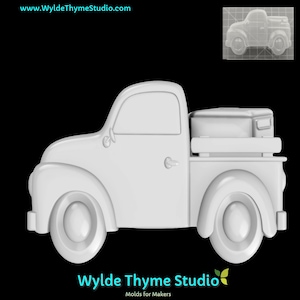 May include: White plastic mold of a vintage pickup truck with a flatbed and a toolbox in the back. The mold is on a black background.