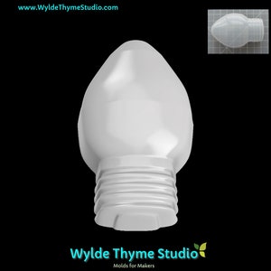 May include: A white plastic mould shaped like a traditional Christmas light bulb. The mould has a rounded top and a textured base.