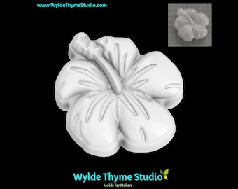 May include: White plastic mold of a hibiscus flower with five petals and a center stamen. The mold is designed for making soap, candles, or other crafts.