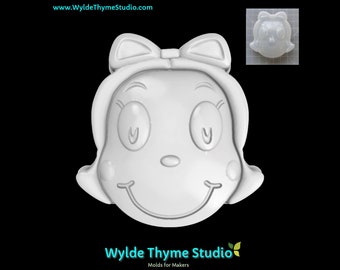 May include: White silicone mold of a girl's face with a bow in her hair. The mold is designed for making soap, resin, or other crafts.