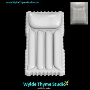 May include: White inflatable pool float with a pillow at the head and four air chambers. The float is designed to resemble a traditional bed.