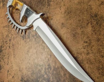 Custom handcrafted D2 steel Bowie knife featuring a wooden handle and a steel guard.