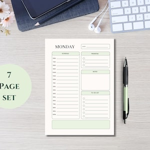May include: A white daily planner page with sage green accents featuring a Monday schedule from 6AM to 9PM, a priorities section, a notes box, and a to-do list with checkboxes. A light green circle on the left displays the text 7 PAGE SET.