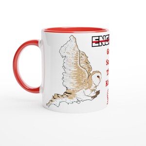 May include: A white ceramic mug with a red handle and interior. The exterior features a graphic of a flying barn owl in shades of brown and white, along with the text "ENGINEER" in black and red, followed by "Go to work, Save the world, The King" in red.