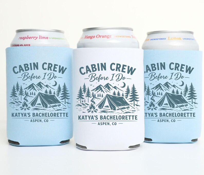 May include: Three beverage insulators with the text "CABIN CREW Before I Do" and a mountain and tent graphic. One is white, two are light blue. The text "KATYA'S BACHELORETTE ASPEN, CO" is also printed on the insulators.