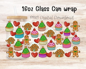 May include: A 16oz glass can wrap PNG digital download featuring a repeating pattern of gingerbread people, decorated Christmas tree cupcakes, pink frosted cupcakes with cherries, gingerbread houses, and red hearts on a light wood background.