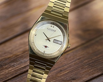 Reloj Citizen Eagle 7 automático vintage con esfera dorada y 21 rubíes para hombre.