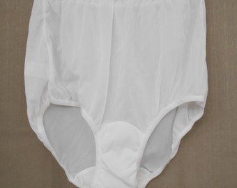 May include: White nylon panties with a full-coverage design. The panties have a smooth, silky texture and a comfortable fit.