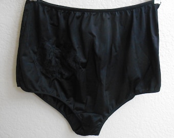 May include: Black high-waisted underwear with a lace trim detail.