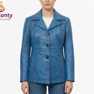 May include: A blue leather jacket with a classic design. The jacket features a notched collar, three black buttons, and a tailored fit. The Monty Jackets logo is in the upper left corner.
